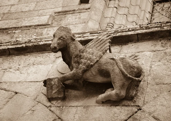 Winged Ox with the bookon the front of  Saint Saviour Basilica — Stock Photo, Image