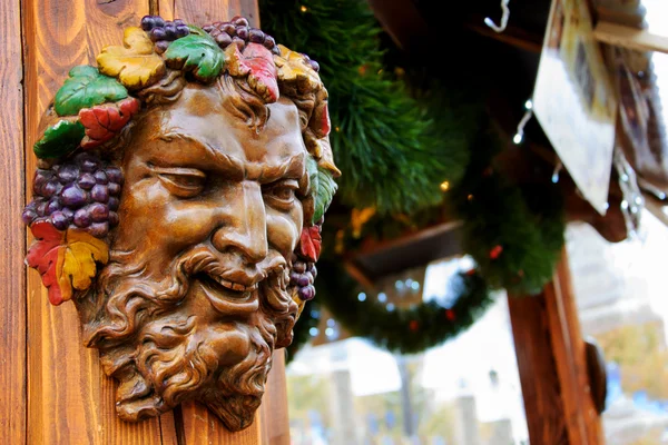 Bacchus (Dionysus) mask at Christmas market — Stock Photo, Image