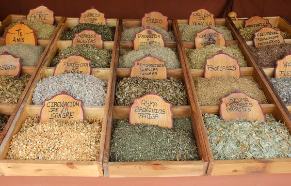 Variety of healing herbal teas at counter in street market in Portugal. — Stock Photo, Image