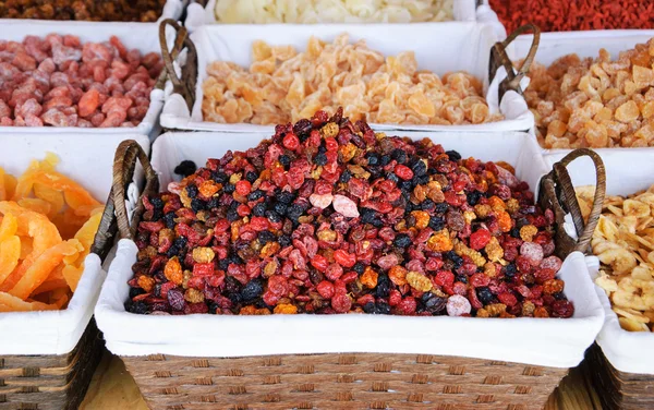 Dried fruits in wicker baskets at local market in Portugal. — Stock Photo, Image