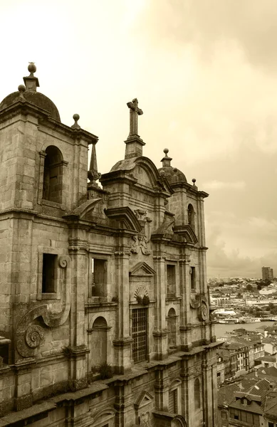 Porto, Portugal. Church of Saint Lawrence (called also Igreja dos Grilos) and view on the city in cloudy day. Aged photo. Sepia. — Stock Photo, Image
