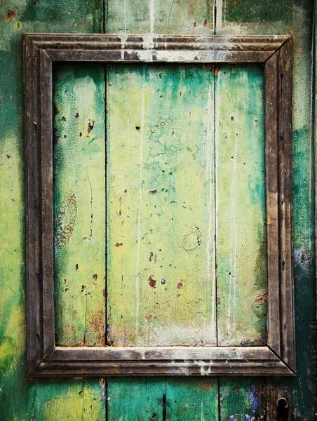 Weathered door with border frame. — Stock Photo, Image