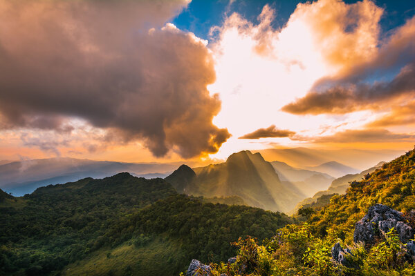 the sun over a mountain range at Doi Luang Chiang Dao, High moun