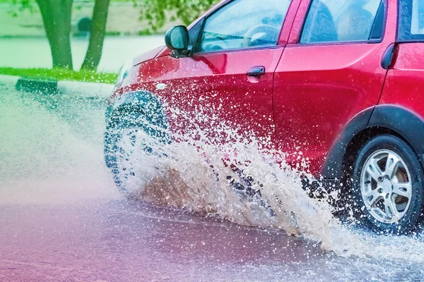 Car rain puddle splashing water — Stock Photo, Image