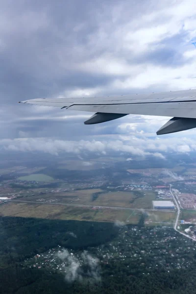 View of the wing of an airplane through the window — Stock Photo, Image