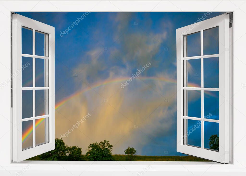 beautiful view from the window to the sky with a rainbow after the rain