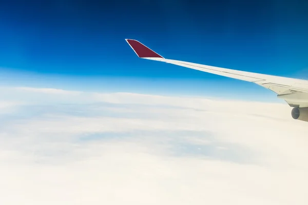 view of the wing of an airplane through the window