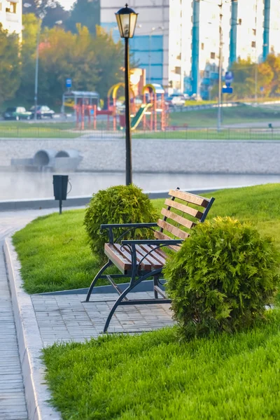 Wooden bench on the promenade sea bay — Stock Photo, Image