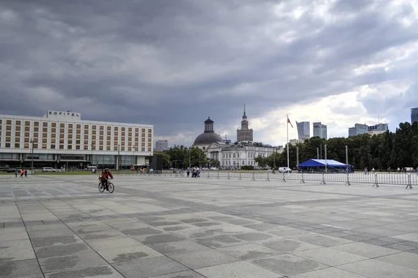 stock image Warsaw city center with Palace of Culture and Science (PKiN), a landmark and symbol of Stalinism and communism, and modern sky scrapers.