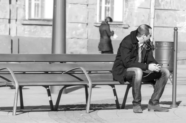 Timisoara Romania March 2016 Man Sitting Bench Street Listening Music — Stock Photo, Image