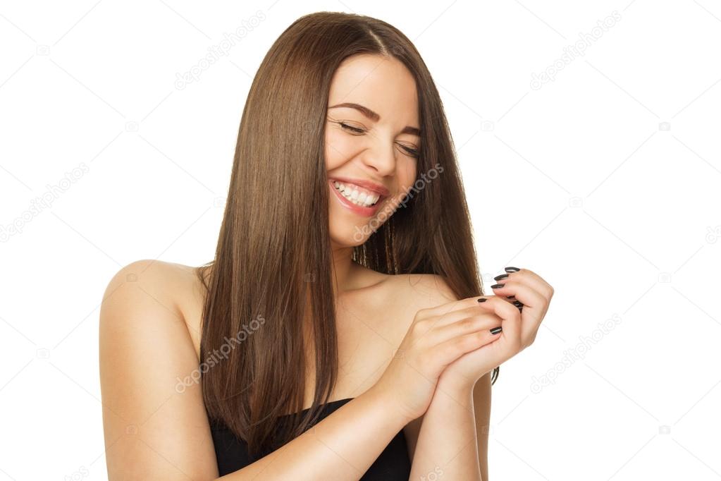 Natural beautiful young brunette woman laughing