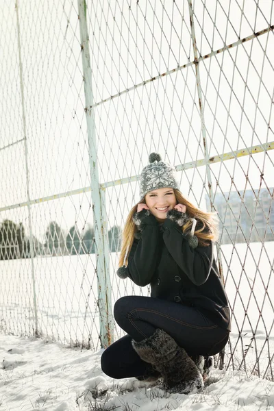Cute blonde teenage girl with hat in park in winter. No retouch. — Stock Photo, Image