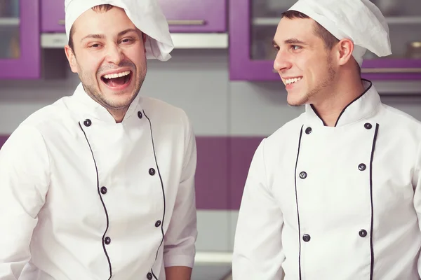 Cooking process, perfect teamwork concept. Portrait of two men — Stock Photo, Image