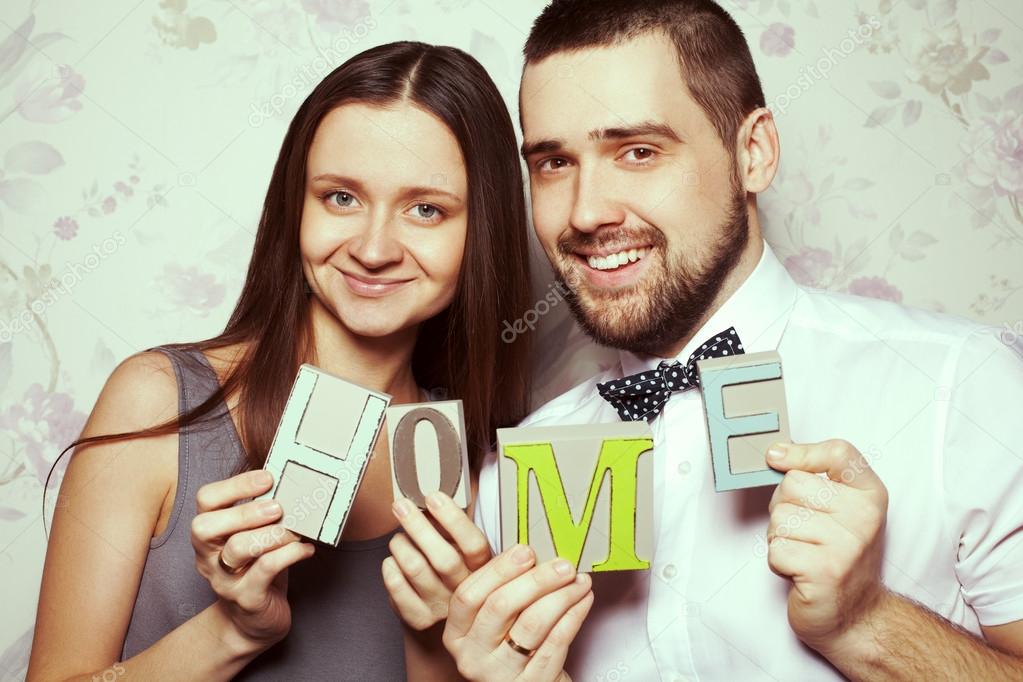 Housewarming party concept. Portrait of funny smiling hipster couple