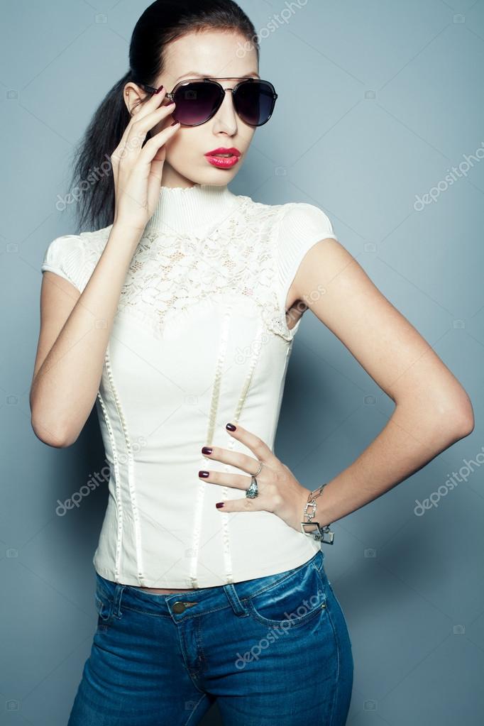 Eyewear concept. Fashionable beautiful young woman in trendy clo