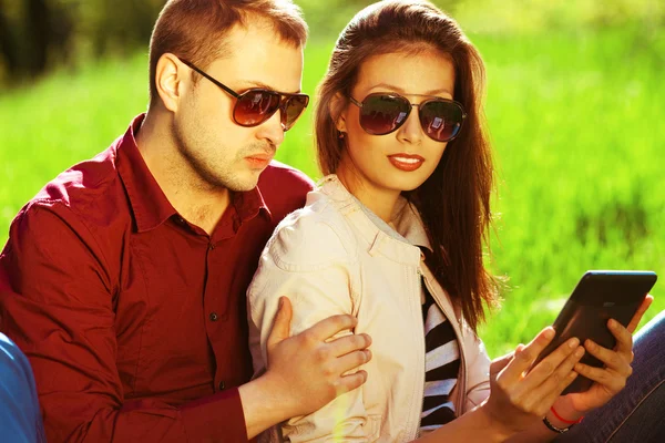 Gadget users concept. Romantic couple in trendy casual clothing — Stock Photo, Image