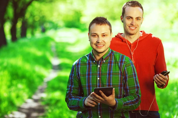 Gadget user concept. Funny hipster guys in trendy casual clothin — Stock Photo, Image