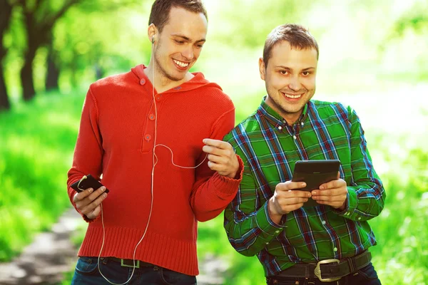Gadget user concept. Funny hipster guys in trendy casual clothin — Stock Photo, Image