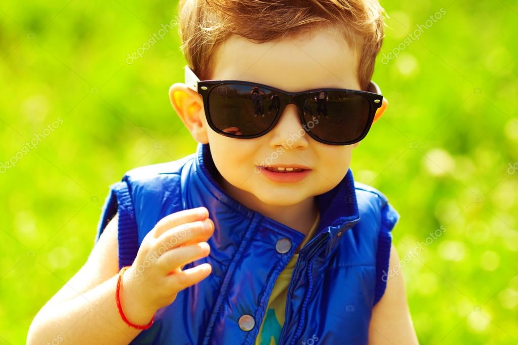Eyewear concept. Stylish baby boy with ginger (red) hair in tren Stock  Photo by ©avgustino 55597153