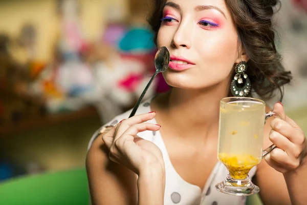 Healthy potion concept. Portrait of beautiful girl drinking herb — Stock Photo, Image