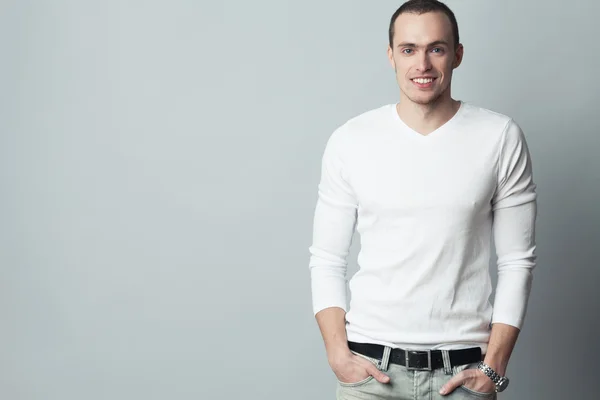 Male beauty concept. Portrait of fashionable young man with hair — Stock Photo, Image