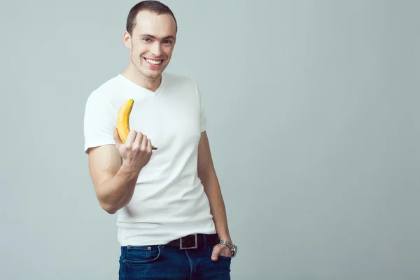 Healthy nutrition concept. Portrait of smiling handsome guy in w — Stock Photo, Image