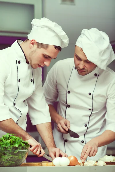 Cooking process concept. Portrait of two funny working men in co — Stock Photo, Image