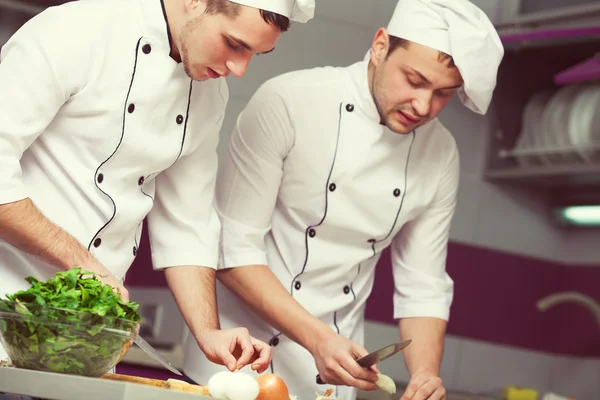 Cooking process concept. Portrait of two funny working men in co — Stock Photo, Image