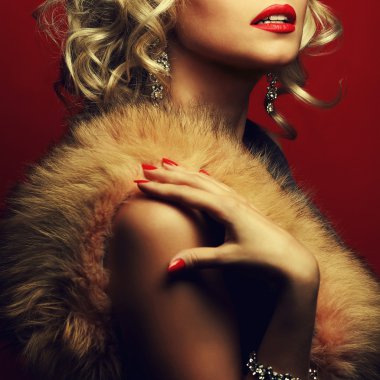 Rich woman concept. Portrait of beautiful blonde with furs clipart