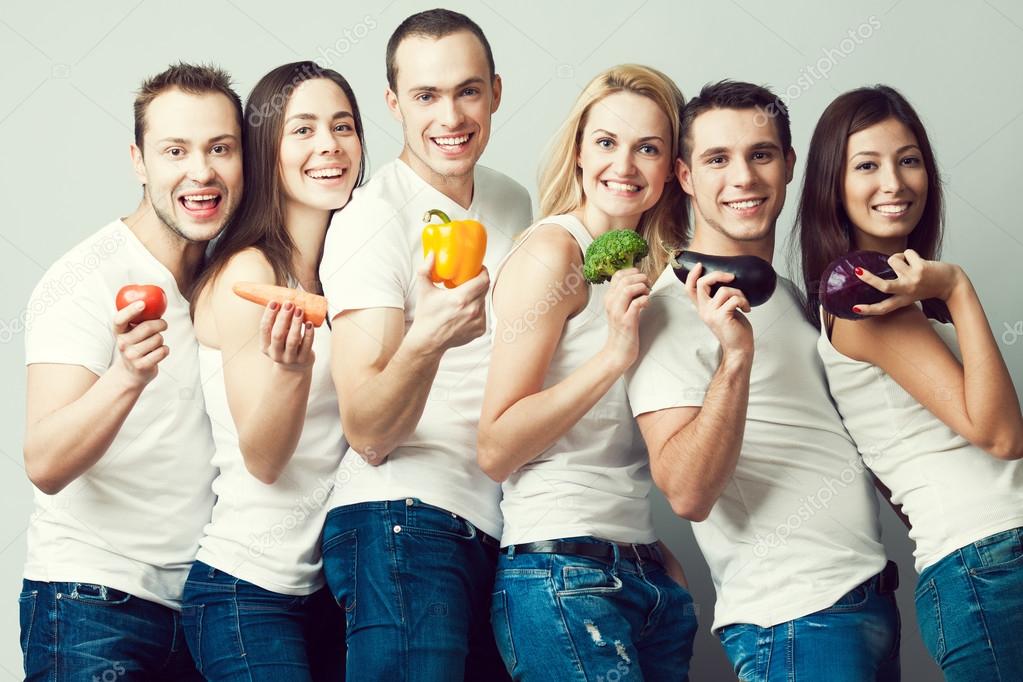 Happy veggies concept. Group portrait of healthy boys and girls 