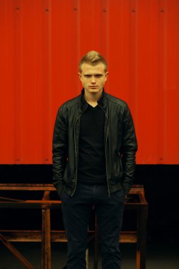Men street fashion concept. Portrait of brutal young man with short hair
