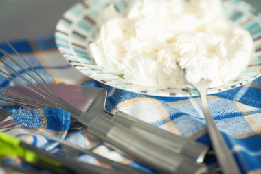 Tiramisu ingredient concept. Mixed mascarpone on plate