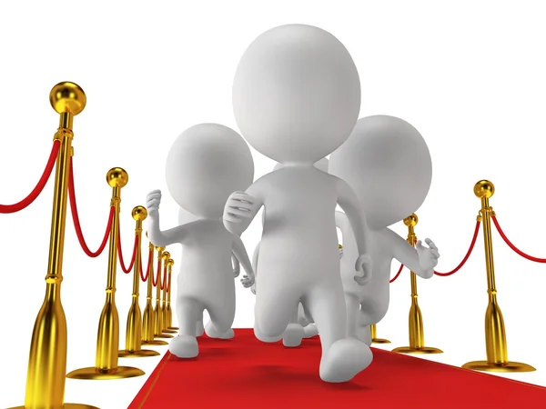 People run on red event carpet with golden rope barriers — Stock Photo, Image