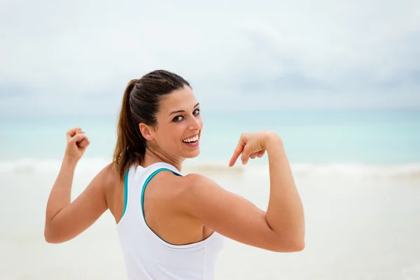 Fitness healthy woman showing biceps — Stock Photo, Image