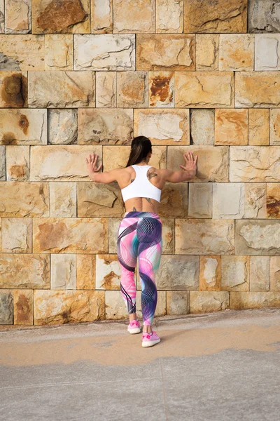 Fitness strong woman on urban fitness stretching workout — Stock Photo, Image