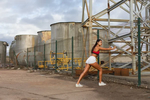 Female Young Athlete Warming Stretching Legs Running Outdoor Industrial Zone — Stock Photo, Image