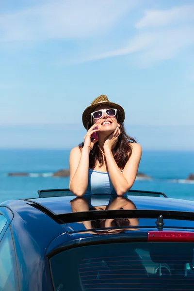 Happy woman on summer car vacation travel talking on cellphone — Stock Photo, Image