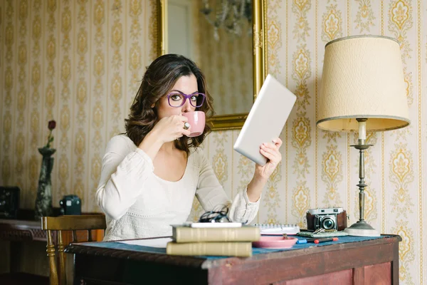 Woman with digital tablet working at home — Stok fotoğraf