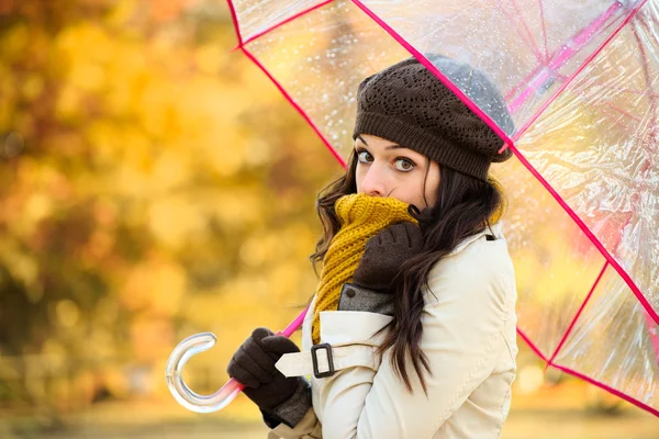 Woman in cold autumn with umbrella — Zdjęcie stockowe