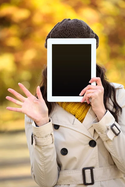 Woman covering her face with digital tablet screen — 스톡 사진