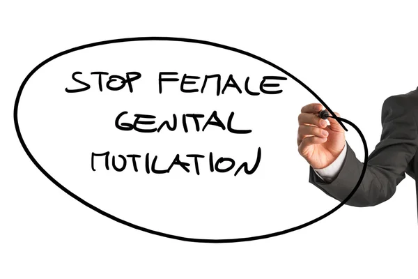 Hombre escribiendo un signo Detener la mutilación genital femenina — Foto de Stock