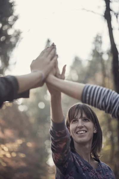 Group of people giving a high fives gesture — Stock Photo, Image