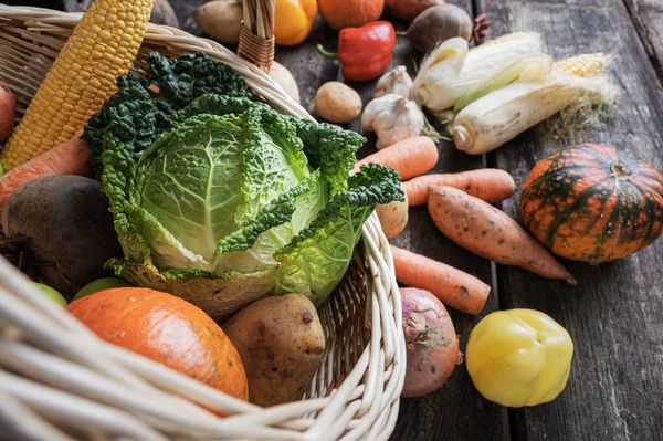 Wicker Basket Full Various Colorful Vegetables Scattering Rustic Wooden Boards — Stock Photo, Image