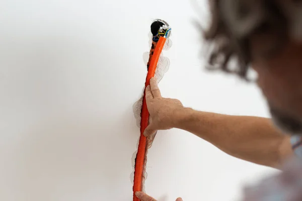 Positioning Orange Corrugated Plastic Tube Electrical Wires Wall — Stock Photo, Image