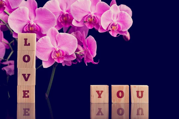 Love You message with pink phalaenopsis orchids — Stok Foto