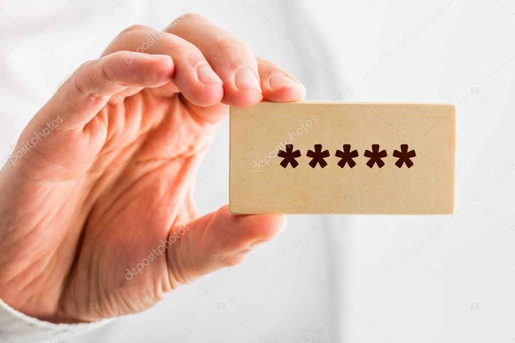 Man holding a wooden block with 5 stars