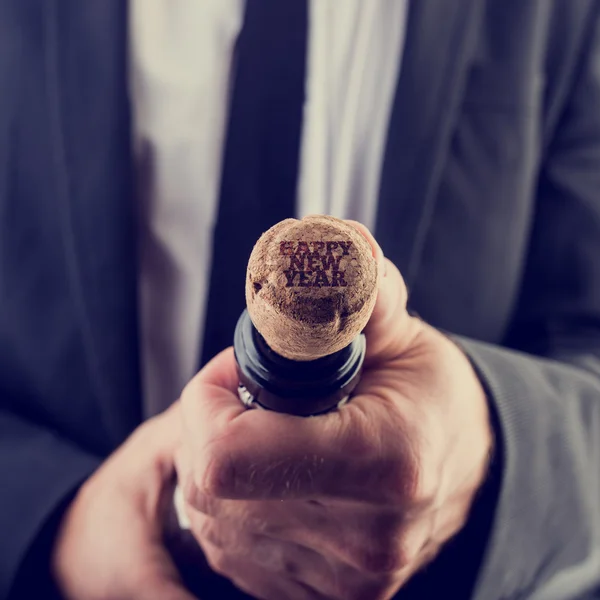 Businessman Opening Wine Bottle for New Year — Stock Photo, Image