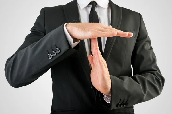 Empresario Mostrando tiempo de espera Señal de mano — Foto de Stock