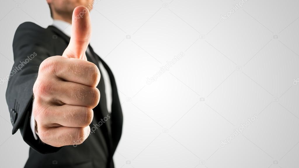 Businessman Showing Thumbs Up Sign in Close Up
