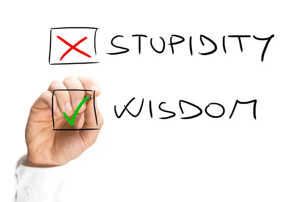 Human Hand Marking X on Stupidity and Check on Wisdom — Stock Photo, Image